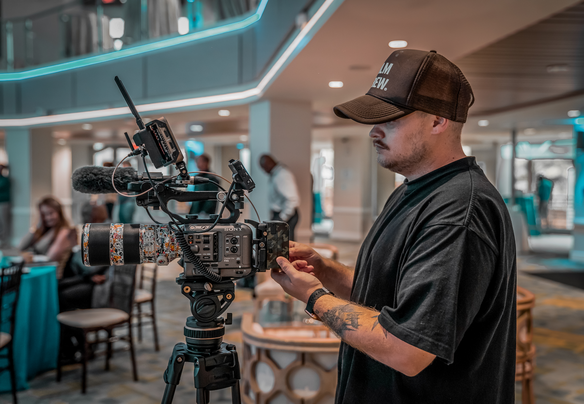 Cody Cochran operating a cinema camera during a production