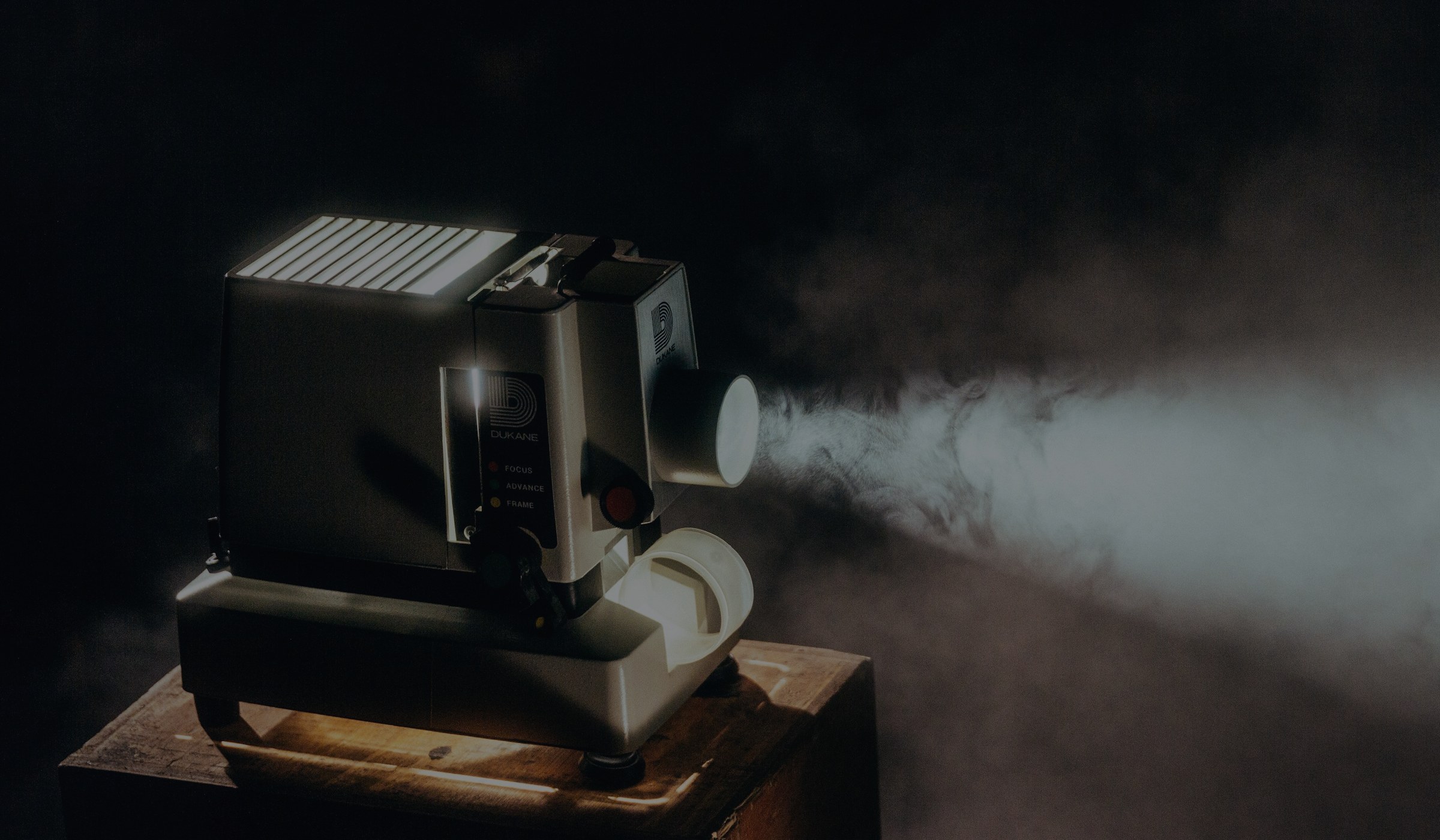 Cinematic film projector beam representing Cochran Films production services